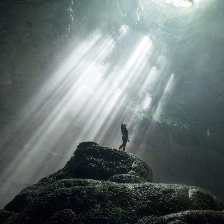 Woman in Beautiful Cavern Photograph
